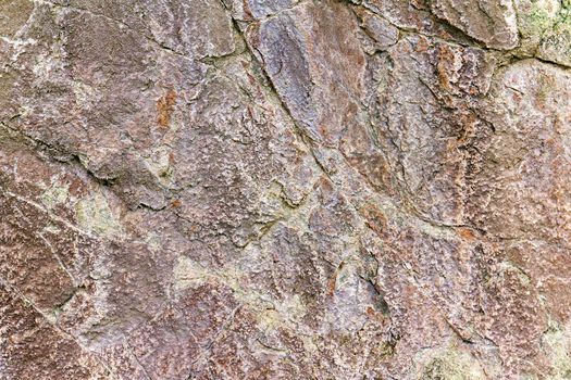 stone rock with cracks in the background