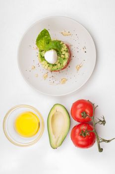 Tomatoes, avocado and olive oil - ingridients and salad