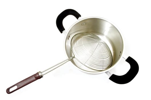 expensive cooking utensil of fine silver pot and metaliic strainer on white background