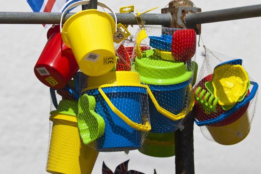 brightly coloured bucket and spade for sale