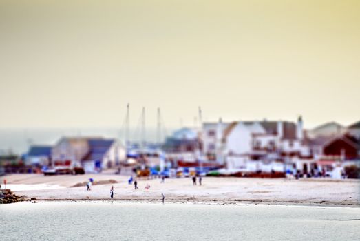 lyme regis beach at sunset with ship masts in background