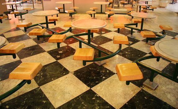 Groups of seating at tables in a food court
