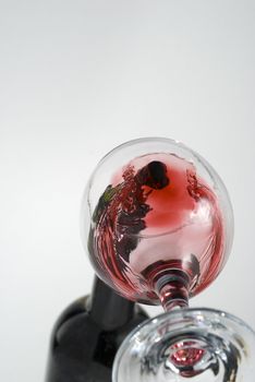 Wine pouring in a glass captured from unusual POV stock photo