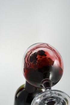 Wine pouring in a glass captured from unusual POV stock photo
