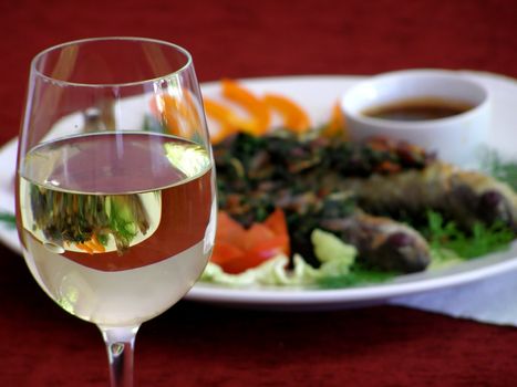wineglass with a dish on the background