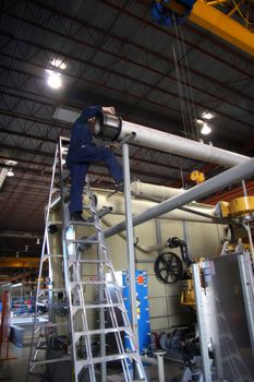Industrial Worker on the ladder