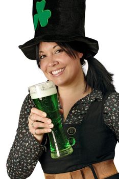 Pretty female with pigtails and hat drinking a tall glass of green beer on St. Patricks Day.

