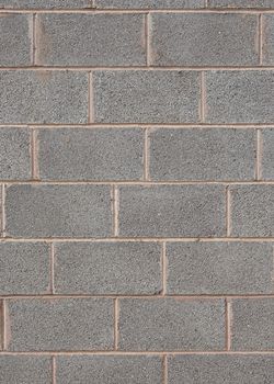 Closeup detail of a grey breeze block wall