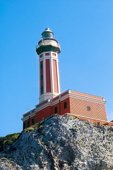 red lighthouse with blue skies, capri italy