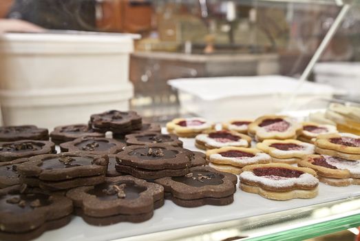 close-up of cakes and biscuits behind display amalfi italy