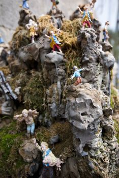 small toy model men on a rock amalfi italy