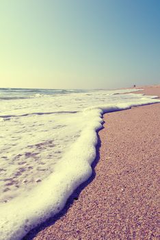 close up of sea wash on beach, vintage colours