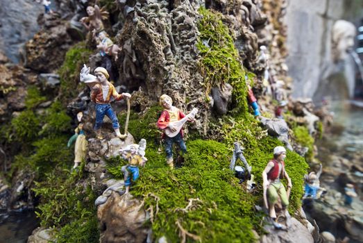 small toy model men on a rock amalfi italy