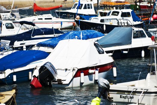 Small Boats floating in Lyme Regis Harbour, Dorset, England