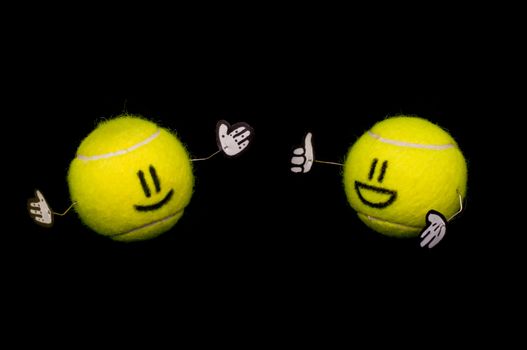 Two happy tennis balls talking with gestures and happyness