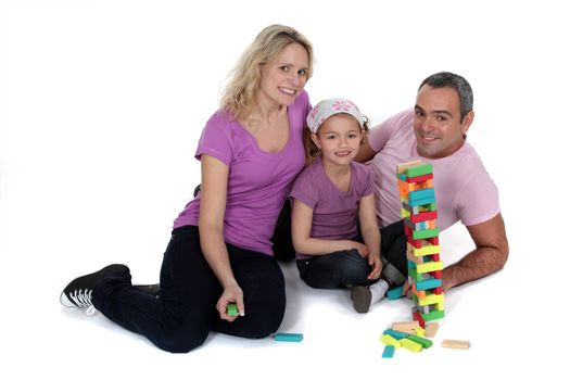 Parents playing with daughter on the floor