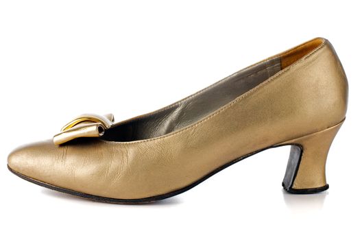 Gold woman shoe on white background.