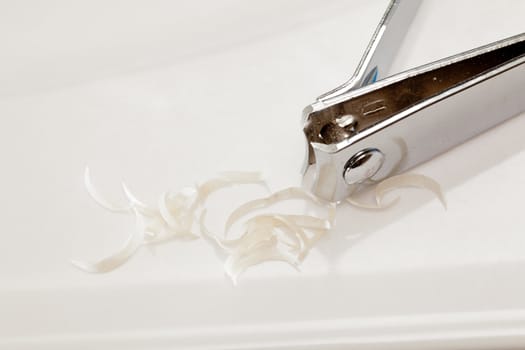 Finger nail clippings on bathroom sink