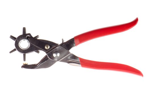 Tool used to pierce belts and shoes on white background.