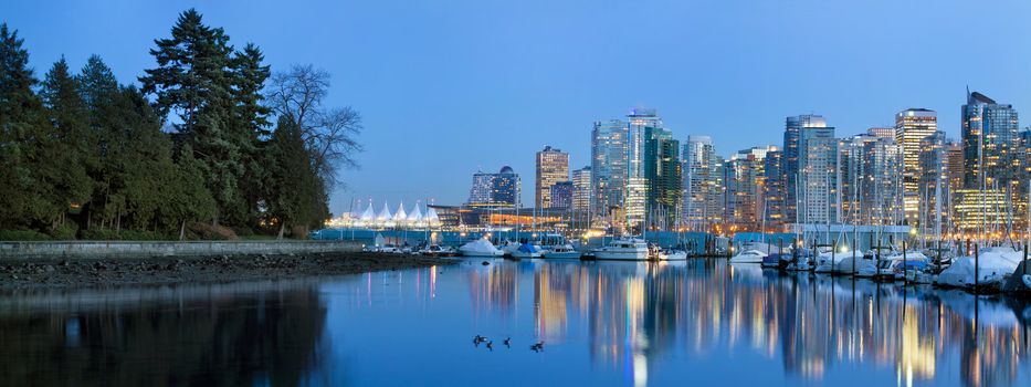 Vancouver BC Canada Skyline and Marina along False Creek from Stanley Park at Blue Hour Panorama