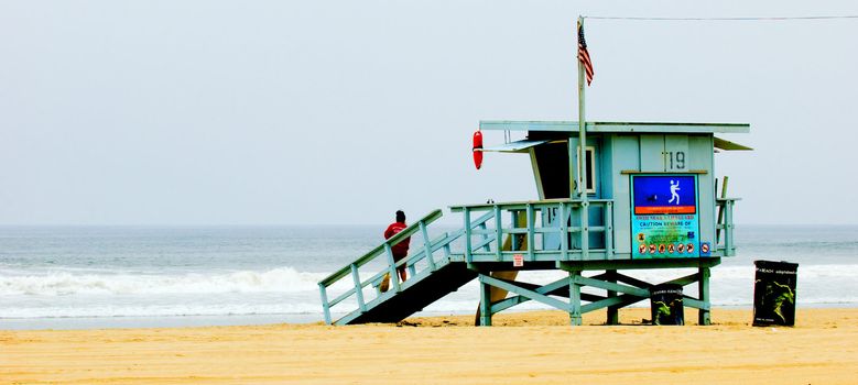 wooden lifeguard hut on california sandy beach
