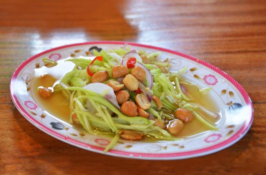 spicy mango salad , thai style food