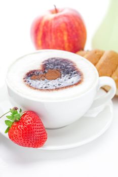 cappuccino in a cup in the shape of hearts,apple ,croissant  and strawberries isolated on white