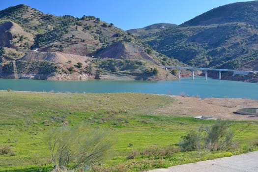 water reservoir on the river and the bridge Campanillas runs over him