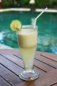 Banana Juice with nice deco beside pool.