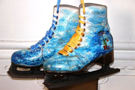 Beautiful ancient skates painted under winter subjects