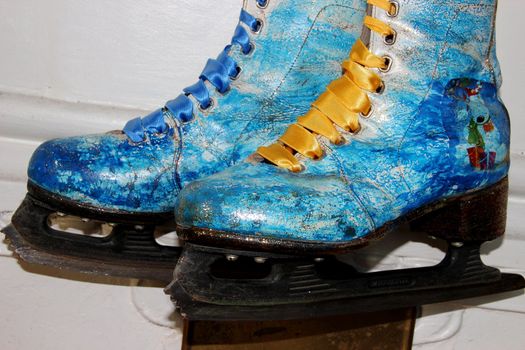 Beautiful ancient skates painted under winter subjects