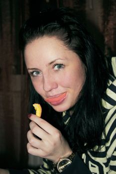 young woman with a slice of orange