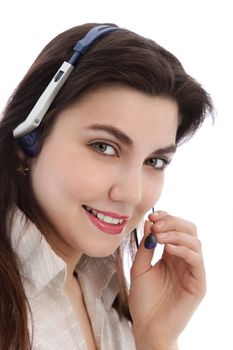 Beautiful call center agent holding a mouthpiece of her headphone