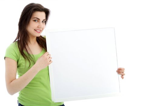 Smiling female showing a blank white board in a close up portrait