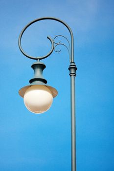 old lantern against the blue sky