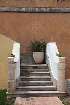 entrance of a house with stairs and flowers