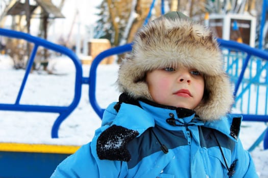 A boy on a winter playground