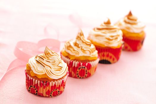 Cupcakes with whipped cream and icing