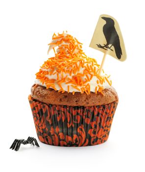 Halloween cupcake with decoration isolated on white