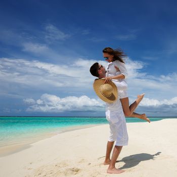 Couple on a tropical beach at Maldives