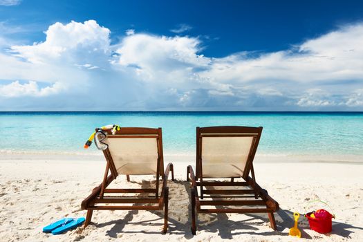 Tropical beach with chaise lounge at Maldives