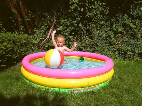 Baby in an inflatable pool