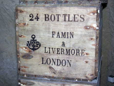 A very old box of wine bottles
