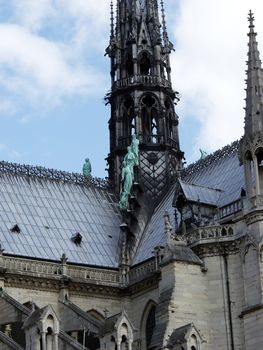 statues of the apostles of Saint Luke at the base of the spire of the cathedral Notre Dame in Paris 