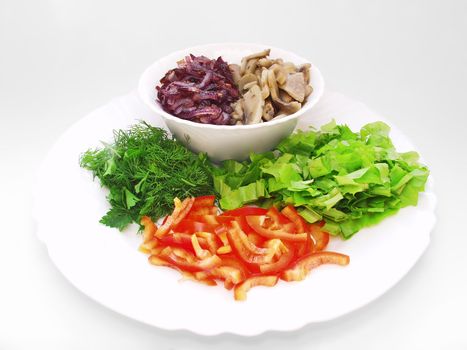 Kitchen ingredients. Mushrooms, onions, peppers and other vegetables on a white background