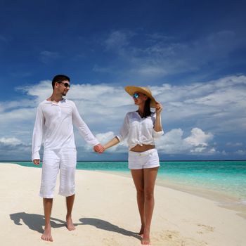 Couple on a tropical beach at Maldives