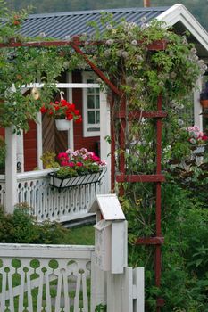A little red cottage in a garden
