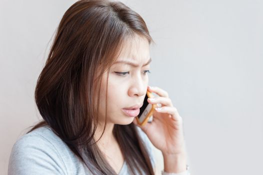 asian woman talking on the mobile phone