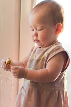 Little girl with christmas toy