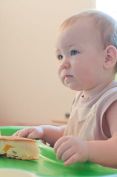 Little thoughtful  girl with cake